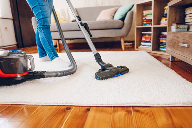 istock A woman cleans her home. Close up on vacuum 2200686840