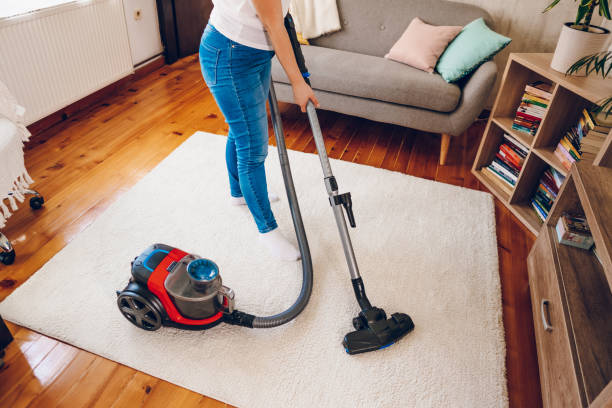 istock A woman cleans her home. Close up on vacuum 2200686910