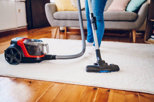istock A woman cleans her home. Close up on vacuum 2200686973