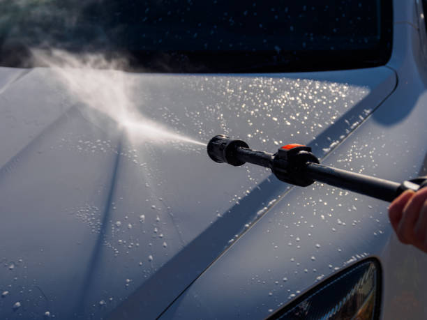istock Manual car high-pressure wash using equipment for effective dirt removal and coating protection. 2200688187