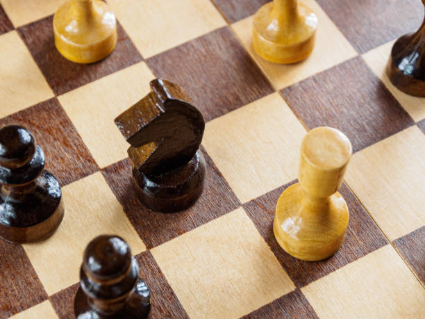 istock Chess pieces on the board with selective focus, creating an atmosphere of strategic play and intellectual confrontation. 2200688465