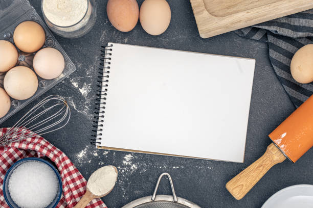 istock Background with baking ingredients and blank book. Baking ingredients. 2200696801