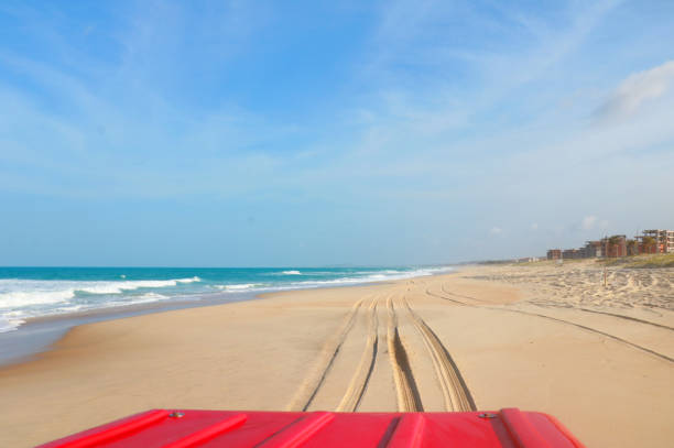 Buggy ride. A buggy is a small motorized vehicle used to travel on sandy or uneven terrain on the Brazilian coast. Aquiráz, Ceará state, Brazil.