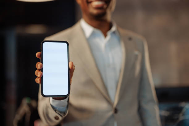 istock Businessman showing smartphone with blank screen 2200713407