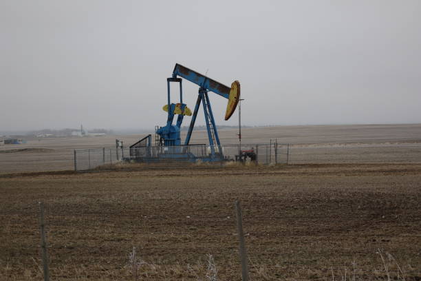 istock A pumpjack on a foggy fall day. 2200715301