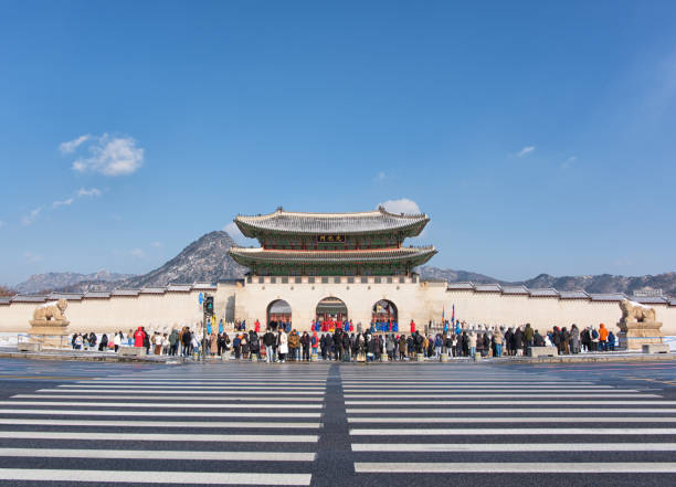 Seoul, Korea - February 7th 2025, Tourists watching the Palace Royal Guard Changing Ceremony at Gwanghwamun Gate, Gyeongbokgung Palace in Jongno-gu, Downtown Seoul Korea. 서울 경복궁 광화문