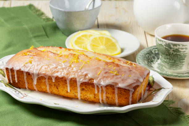 istock Aromatic lemon cake, covered with sugar icing and sprinkled with zest, served with tea. 2200727210