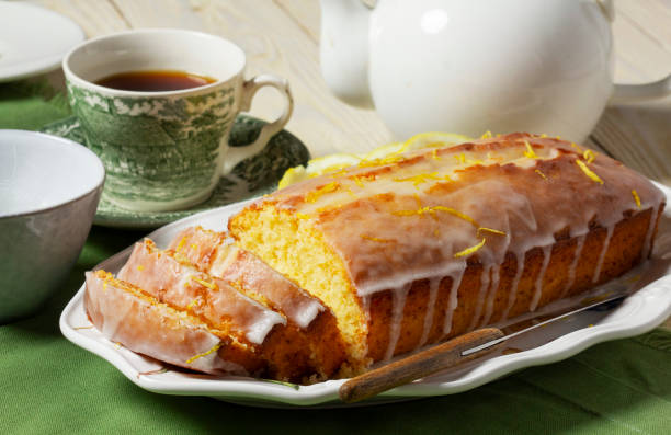 istock Aromatic lemon cake, covered with sugar icing and sprinkled with zest, served with tea. 2200727215