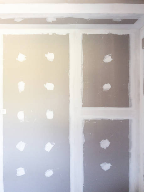 istock Unfinished Drywall Ceiling with Joint Patching in a House Under Construction. 2200730368