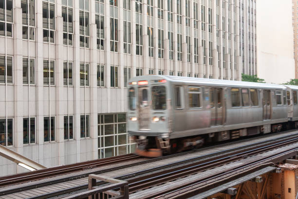 istock Chicago El train in motion on elevated tracks in the downtown loop. 2200732285