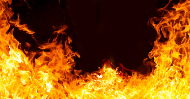 istock An intense image of red flames blazing against a black background. 2200734925