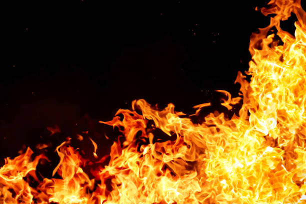 istock An intense image of red flames blazing against a black background. 2200734961