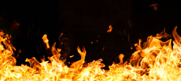 istock An intense image of red flames blazing against a black background. 2200734965