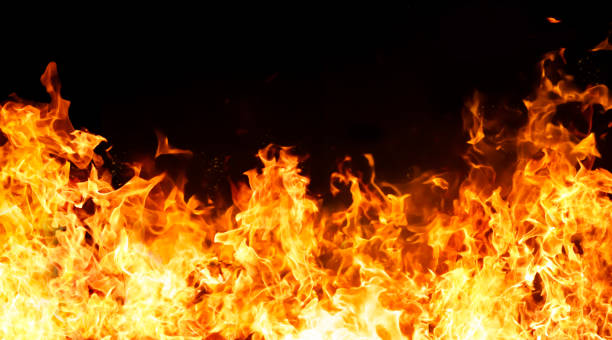 istock An intense image of red flames blazing against a black background. 2200734985