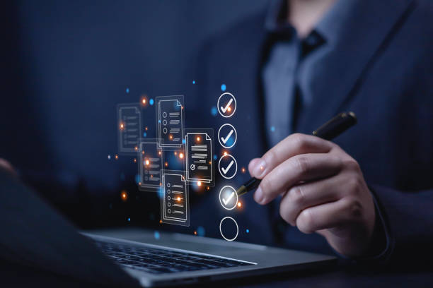 istock Business performance checklist concept, Businessman using laptop take an assessment,An businessman checklist online survey filling form list options business employee security procedures. 2200741130