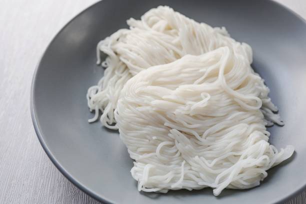 istock Thai rice noodle in greyceramic plate on white background  , thai called Khanom Jeen 2200742559