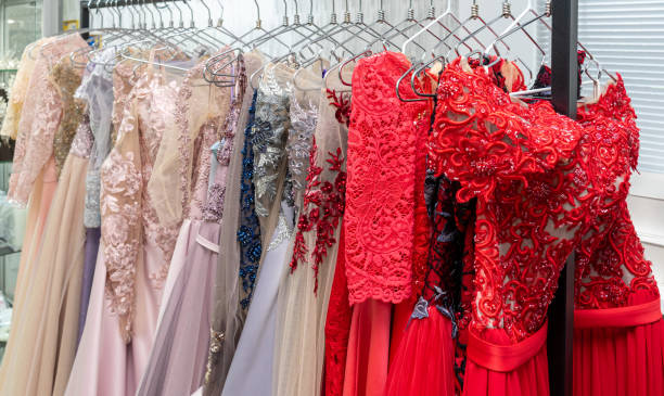 istock Multicolored wedding and evening dresses on a rack in a bridal shop 2200743576