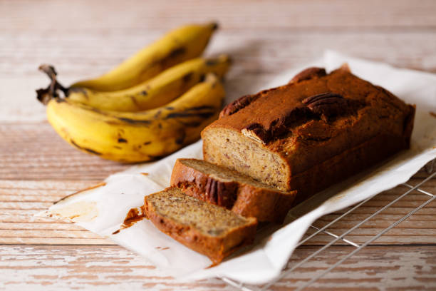 istock Banana bread loaf on wooden table. 2200747053