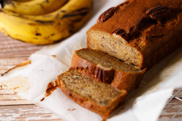 istock Banana bread loaf on wooden table. 2200747054