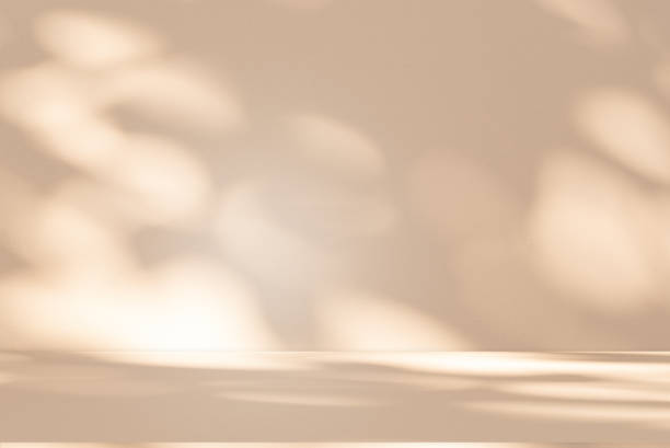 istock Studio style background wall decoration presentation uses white and beige tones. with shadows cast from a nearby window, concept creating a decorative 2200749206