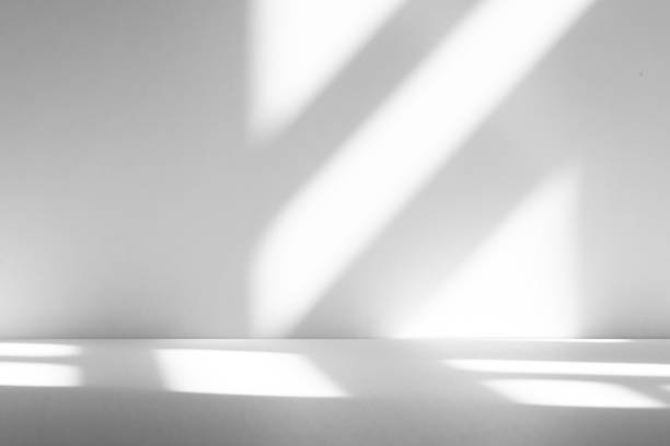 istock Wall interior background, studio and backdrops show products.with shadow from window color white . background for text insertion and presentation product 2200749332