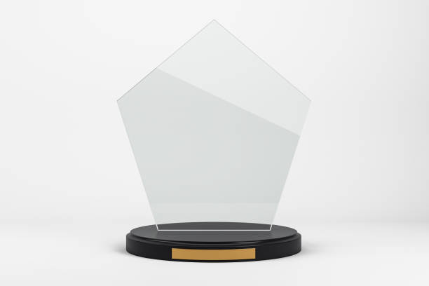 istock Transparent glass trophy mockup on black base with golden plate. 3D Rendering 2200762149