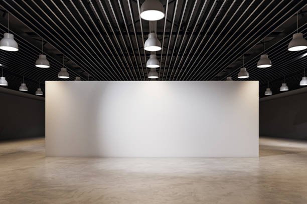 istock Blank exhibition wall in modern event hall with industrial ceiling lights. 3D Rendering 2200762300