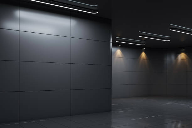 istock Modern dark exhibition hall with spotlights and tiled walls. 3D Rendering 2200762308