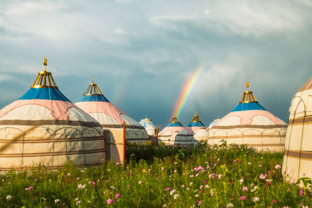Rainbow over Mongolian yurts on summer grasslands, Inner Mongolia, China