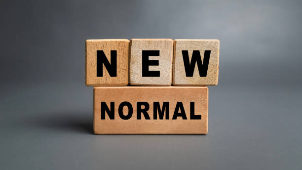 istock new normal words symbol on wooden blocks isolated on grey background 2200767970
