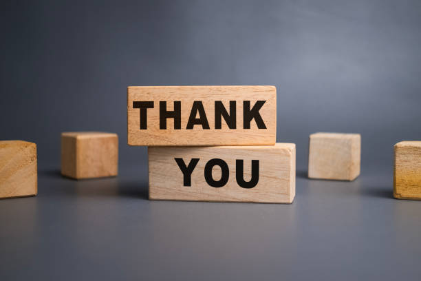 istock thank words symbol on wooden blocks isolated on grey background 2200767976