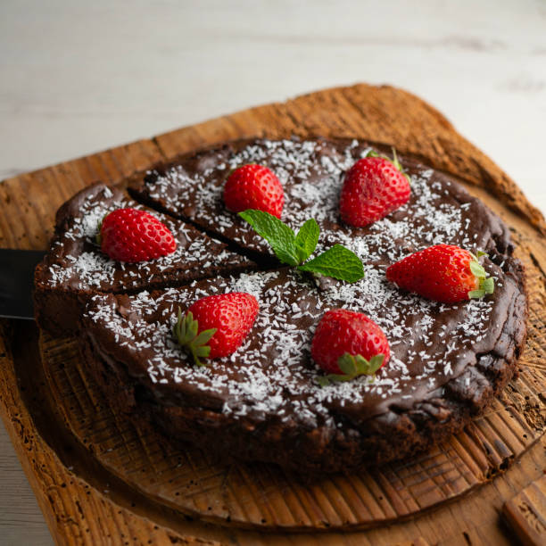 Delicious sweet cheesecake with chocolate and fresh strawberries..
