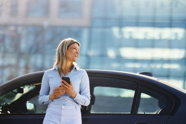 istock Happy businesswoman using cell phone on a break from her trip. 2200770968