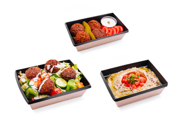istock Delicious hummus topped with fresh tomatoes and herbs served in a stylish container 2200772122