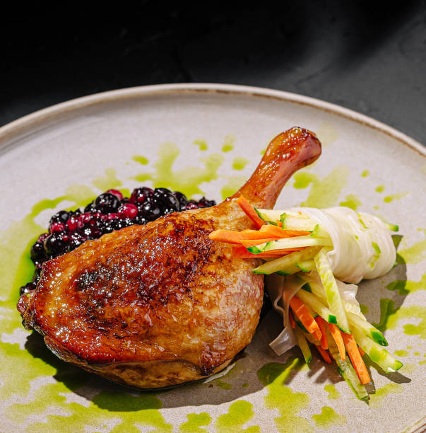 istock Elegant dish of seared duck breast garnished with vegetables served on a decorative plate 2200774045