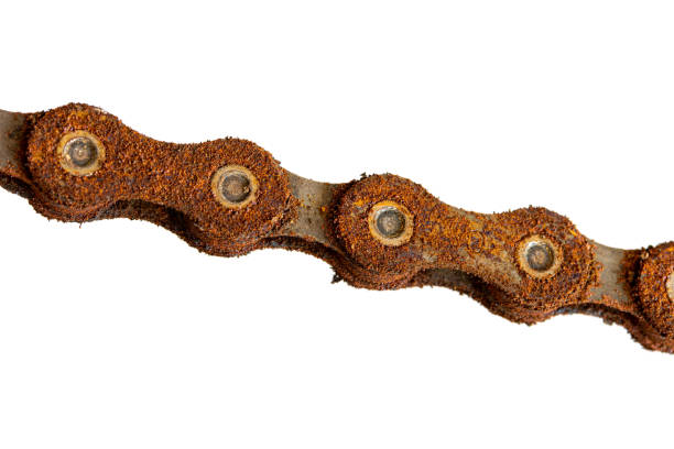 The rusty chain close up, isolated on white background. A rusty bicycle chain, macro view.