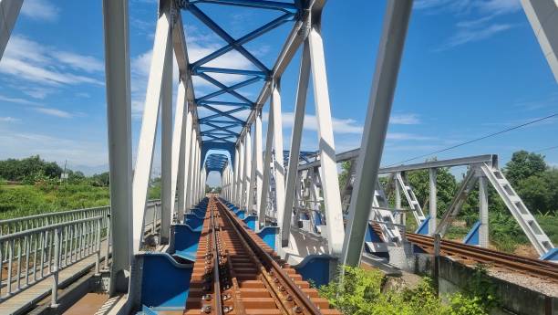 istock Railway track on a metal bridge over a river. 2200783154