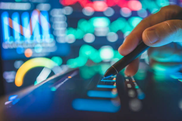 Business advisors using digital gadget to tracking financial goals with artificial intelligence and chatbot to track financial goals and investment performance. Suitable for themes of personal finance and financial planning 2025