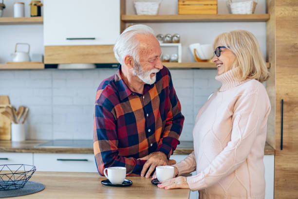istock Senior couple enjoying morning coffee in the kitchen 2200785202