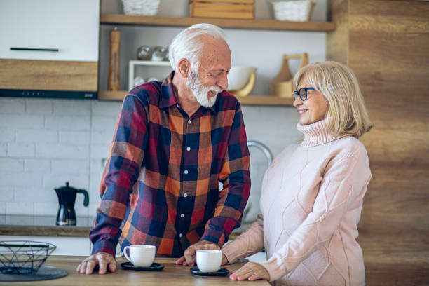 istock Senior couple enjoying morning coffee in the kitchen 2200785216
