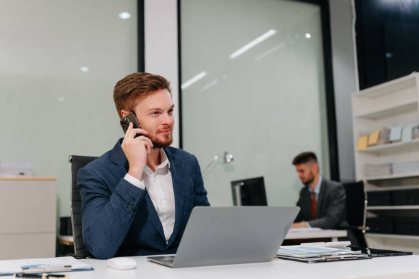 istock Business man working at office with laptop and documents on desk, financial adviser analyzing data. 2200791278