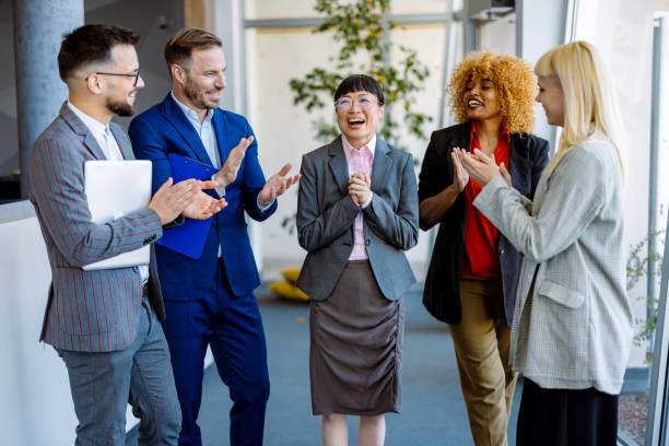 istock Diverse Team Celebrating Success in Office Environment 2200792786