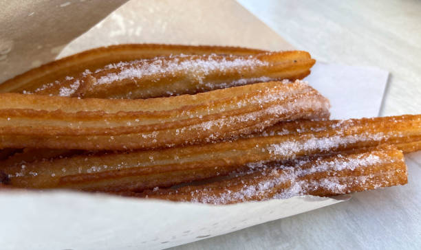 istock Churros on a white background typical Spanish sweet. 2200795602