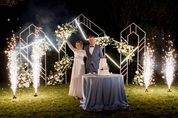 istock newlyweds happily cut and taste the wedding cake 2200795716