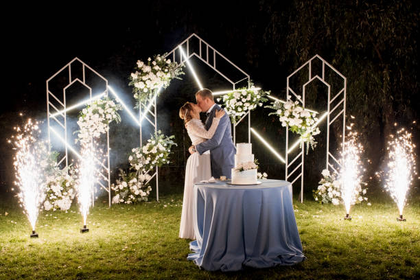istock newlyweds happily cut and taste the wedding cake 2200795867