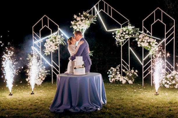 istock newlyweds happily cut and taste the wedding cake 2200796734