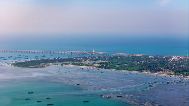 istock High-angle drone shot capturing the Pamban Railway Bridge with its stunning double-leaf bascule section, allowing ships to pass beneath. 2200798349