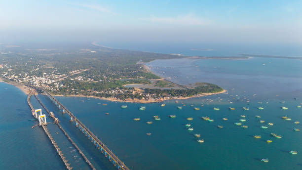 istock High-angle drone shot capturing the Pamban Railway Bridge with its stunning double-leaf bascule section, allowing ships to pass beneath. 2200798406