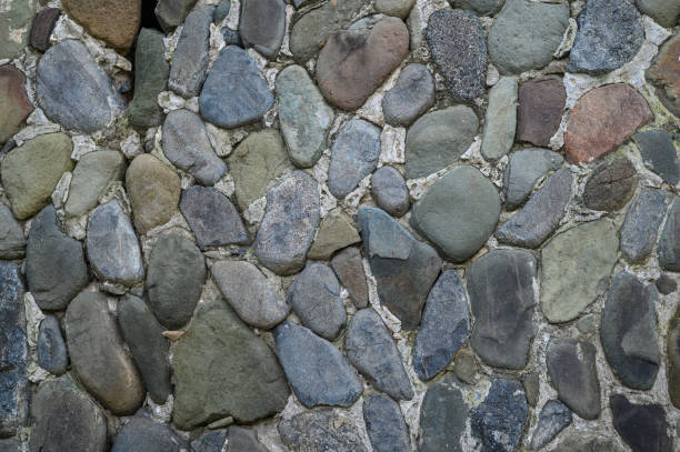 istock Natural stone wall creates rustic charm in a serene garden setting at dusk 2200803400