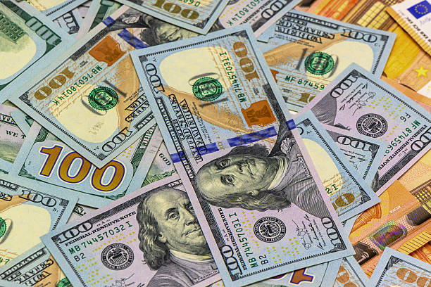 istock Colorful assortment of currency notes showcasing wealth and diversity during an economic discussion 2200803413